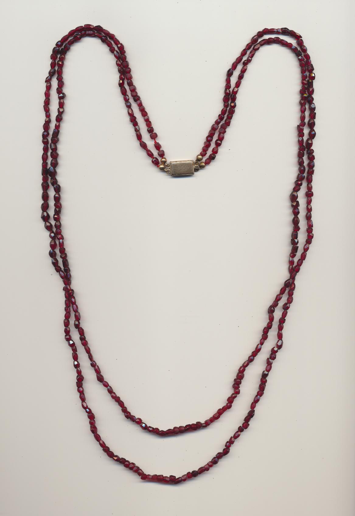 Antique so called farmers necklace made of red garnets, on red cotton thread with gold clasp, Bohemia, ca.1900, length inner row 29'' 74cm., outer row 30.3.'' 77cm.